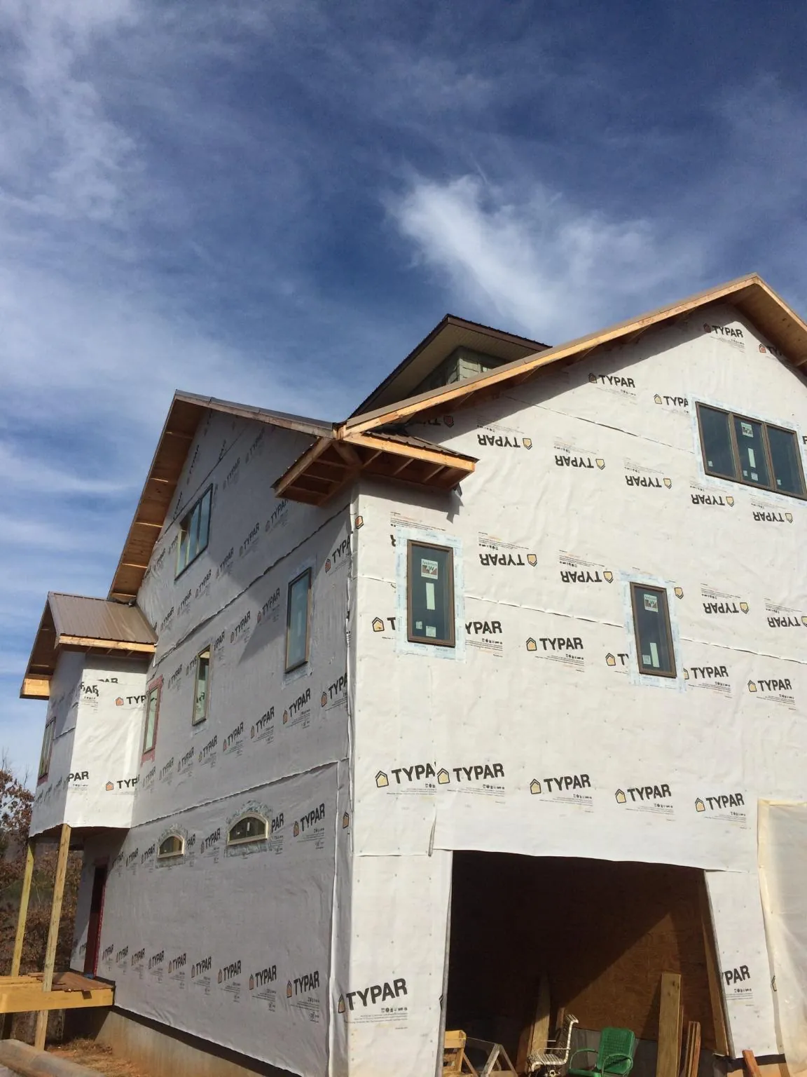 Stick built house wrapped in Typar with new roof framing and dormers in Cedartown